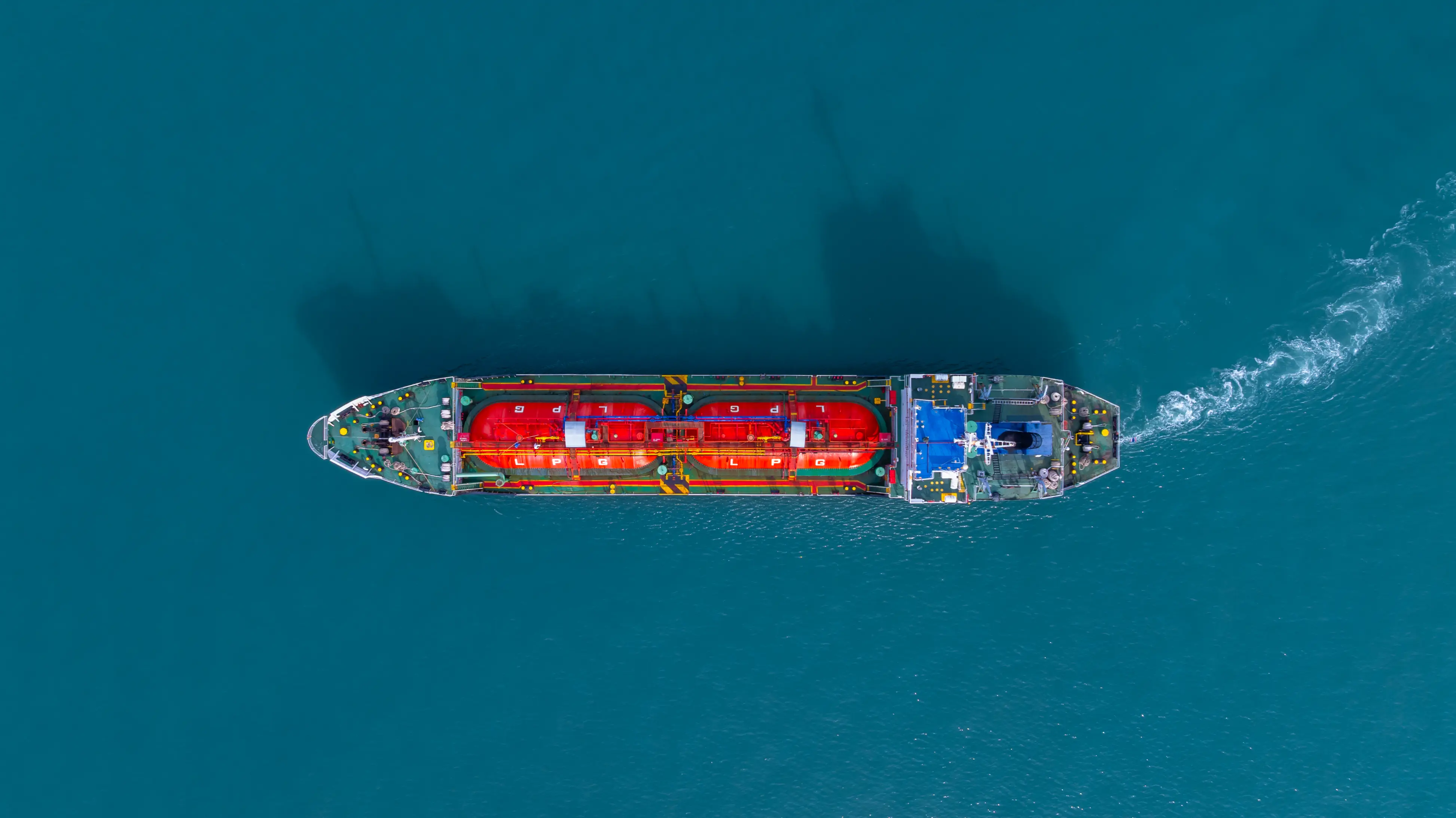 Aerial view of an LPG gas tanker ship in deep blue sea waters