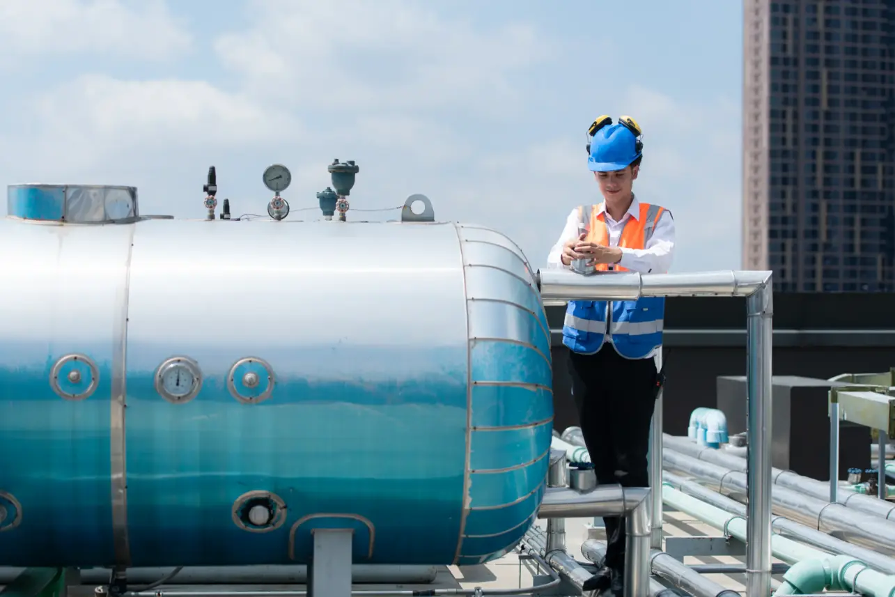 Technician inspecting industrial equipment